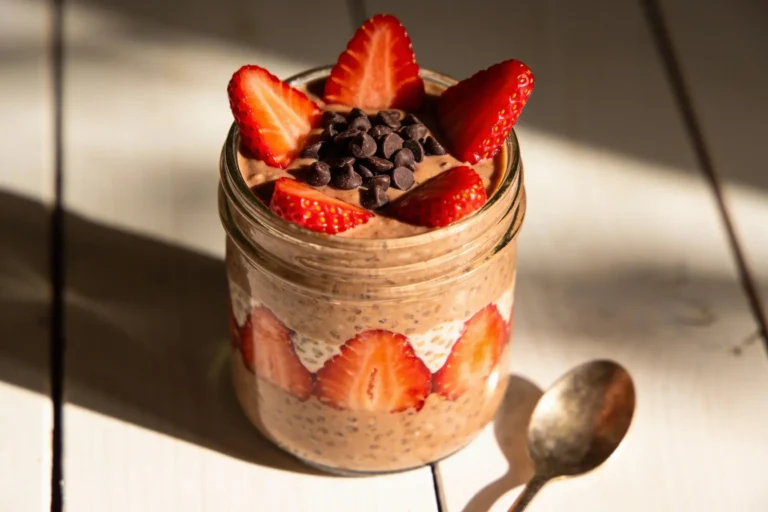Jar of chocolate strawberry overnight oats with strawberries