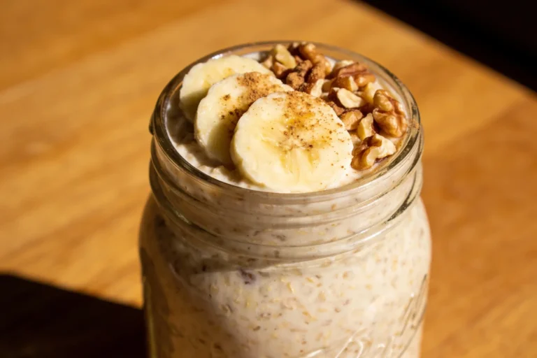 Jar of banana bread overnight oats with banana slices
